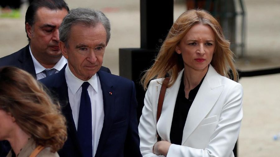 Bernard Arnault, CEO of LVMH Moet Hennessy Louis Vuitton SE, and Delphine Arnault, Executive Vice President of Louis Vuitton, leave after the Spring/Summer 2020 collection show for fashion house Louis Vuitton during Men's Fashion Week in Paris, France, June 20, 2019. REUTERS/Charles Platiau