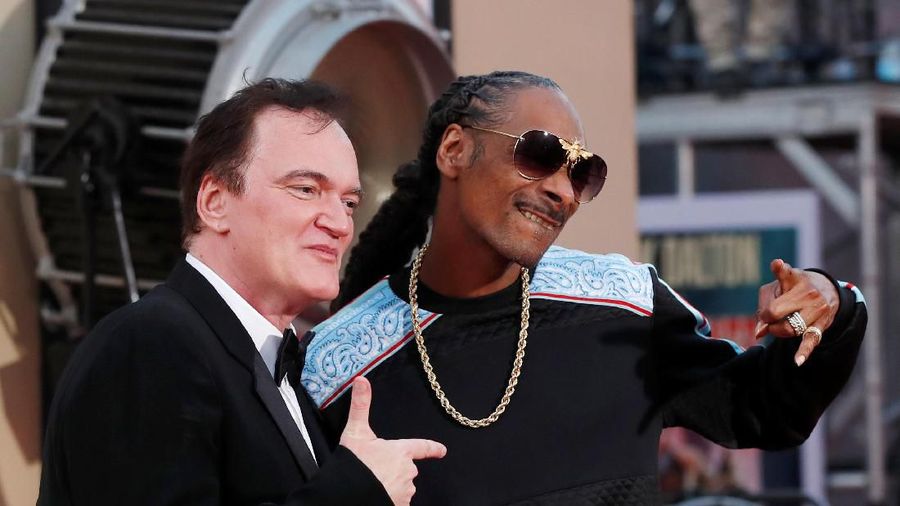 Director Quentin Tarantino and musician Snoop Dogg attends the premiere of