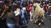 Festival tradisional ini dilangsungkan dari 1 Agustus hingga 6 Agustus 2019. (Photo by Oscar Rivera / AFP)