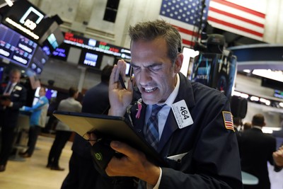 Financial Markets Wall Street Trader Gregory Rowe works on the floor of the New York Stock Exchange, Monday, Aug. 5, 2019. Stocks plunged on Wall Street Monday on worries about how much President Donald Trump's escalating trade war with China will damage the economy. (AP Photo/Richard Drew)