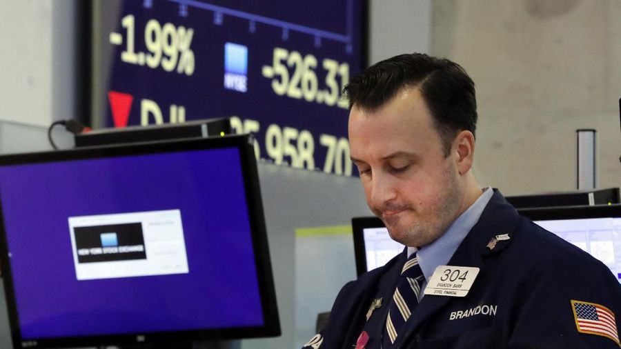 Trader Gregory Rowe works on the floor of the New York Stock Exchange, Monday, Aug. 5, 2019. Stocks plunged on Wall Street Monday on worries about how much President Donald Trump's escalating trade war with China will damage the economy. (AP Photo/Richard Drew)