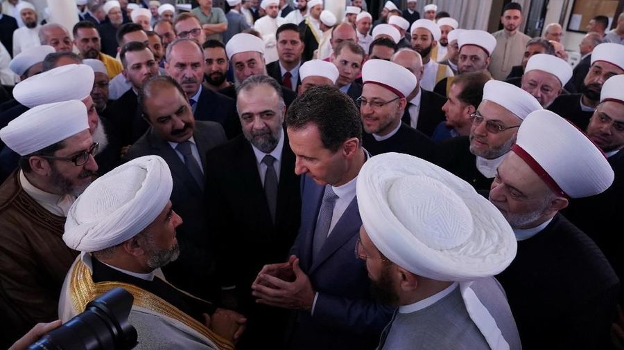 Syria's President Bashar Al-Assad greets his supporters during Eid al-Adha prayers at a mosque in Damascus, Syria in this handout released by SANA on August 11, 2019. SANA/Handout via REUTERS