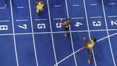 Sejumlah pihak menilai Usain Bolt bisa memiliki catatan waktu yang lebih baik dari 9,58 detik di Kejuaraan Dunia Atletik 2009 jika tidak melambatkan larinya. (HARALD LIBUDA / AFP)