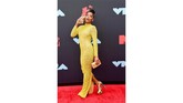 Keke Palmer memiih memakai gaun body contour seksi berwarna kuning cerah rancangan dari desainer Yousef Aljasmi (REUTERS/Caitlin Ochs).