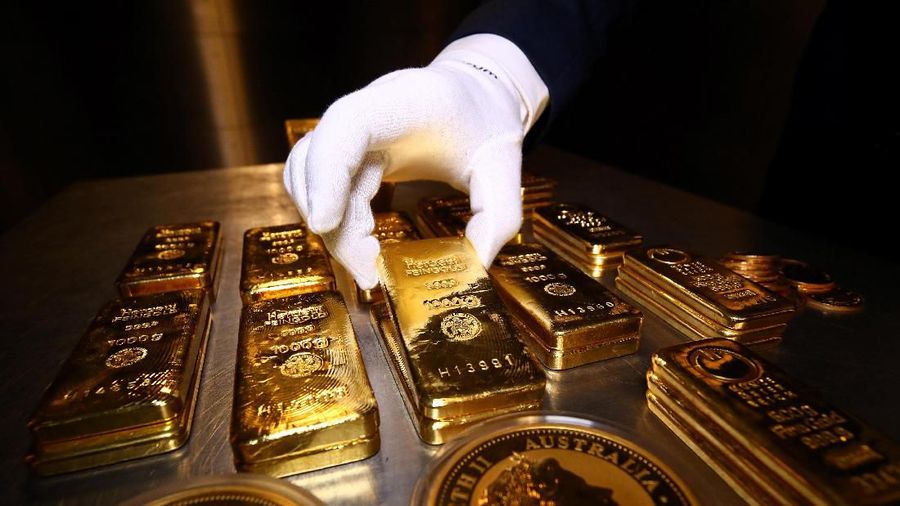 Gold bars and coins are stacked in the safe deposit boxes room of the Pro Aurum gold house in Munich, Germany,  August 14, 2019. REUTERS/Michael Dalder