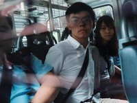 Pro-democracy activists Joshua Wong and Agnes Chow arrive at the Eastern Court by police van after being arrested on suspicion for organising illegal protests, in Hong Kong, China August 30, 2019. REUTERS/Tyrone Siu