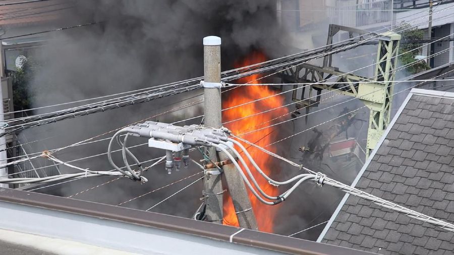 A view of fire and smoke at the site of a train derailment following a collision between an express train and a truck in Yokohama, Japan, September 5, 2019 in this picture obtained from social media. Mandatory credit TWITTER @TATSU_PHOTO/via REUTERS ATTENTION EDITORS - THIS IMAGE HAS BEEN SUPPLIED BY A THIRD PARTY. MANDATORY CREDIT. NO RESALES. NO ARCHIVES.