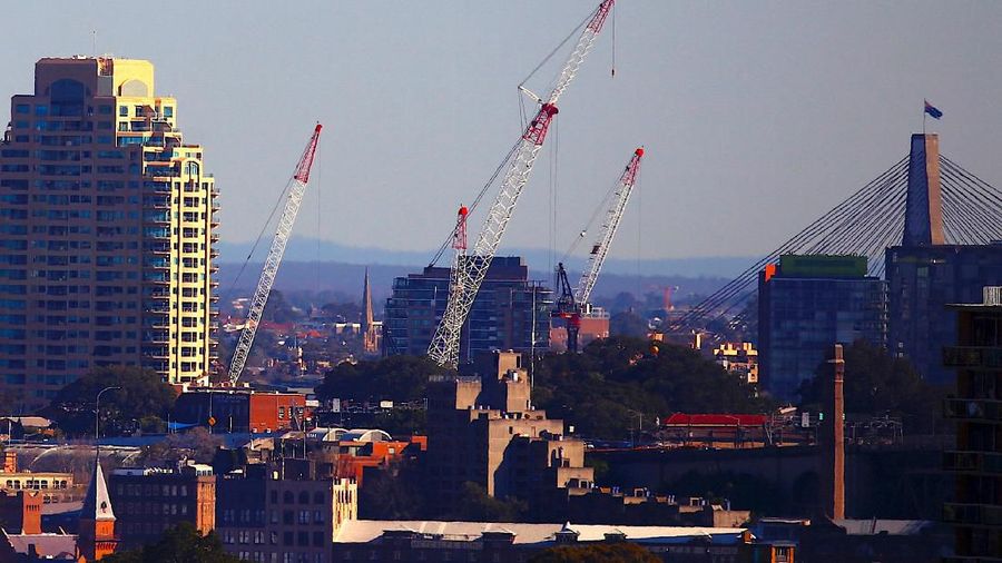 FILE PHOTO: Cranes can be seen on a construction site at the inner-city suburb of Barangaroo, the site of the Australian casino operator Crown Resorts new Sydney waterfront resort, in Sydney, Australia, August 9, 2018.    REUTERS/David Gray/File Photo