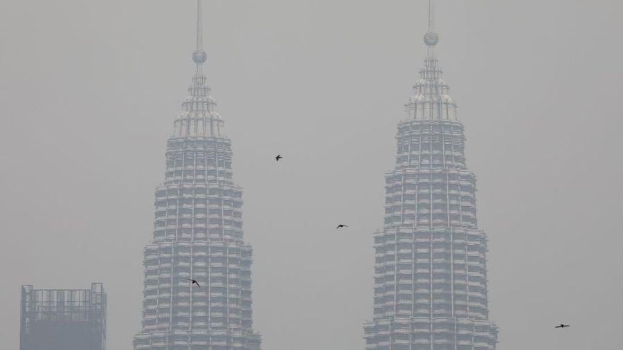 Petronas Twin Towers are shrouded by haze in Kuala Lumpur, Malaysia, September 9, 2019. Picture taken on September 9, 2019. REUTERS/Lim Huey Teng