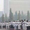 Arms clasped, Muslims pray for rain in Pekanbaru, Riau province, Indonesia, Wednesday, Sept. 11, 2019. Authorities shut most schools in parts of Indonesia's Sumatra island to protect children from a thick, noxious haze as deliberately set fires burne