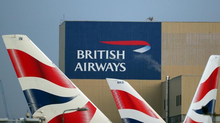 FILE PHOTO: British Airways logos are seen on tail fins at Heathrow Airport in west London, Britain, February 23, 2018. REUTERS/Hannah McKay/File Photo