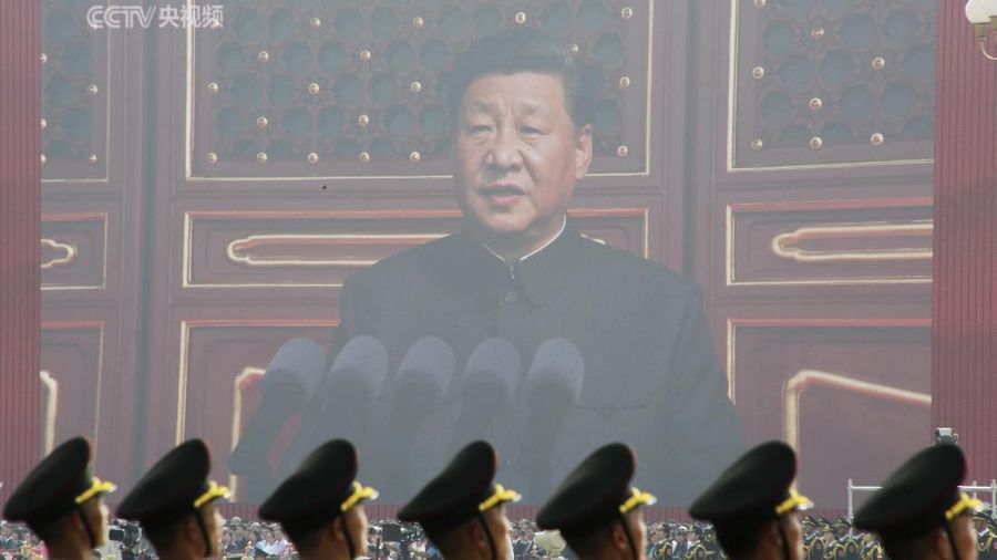 Soldiers of People's Liberation Army (PLA) are seen before a giant screen as Chinese President Xi Jinping speaks at the military parade marking the 70th founding anniversary of People's Republic of China, on its National Day in Beijing, China October 1, 2019. REUTERS/Jason Lee