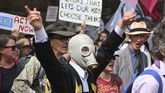 Demonstran 'Pemberontak Kepunahan' (Extinction Rebellion) di seluruh Australia dan Selandia Baru mendesak pemerintah segera bertindak guna mengatasi perubahan iklim. (Photo by PETER PARKS / AFP)