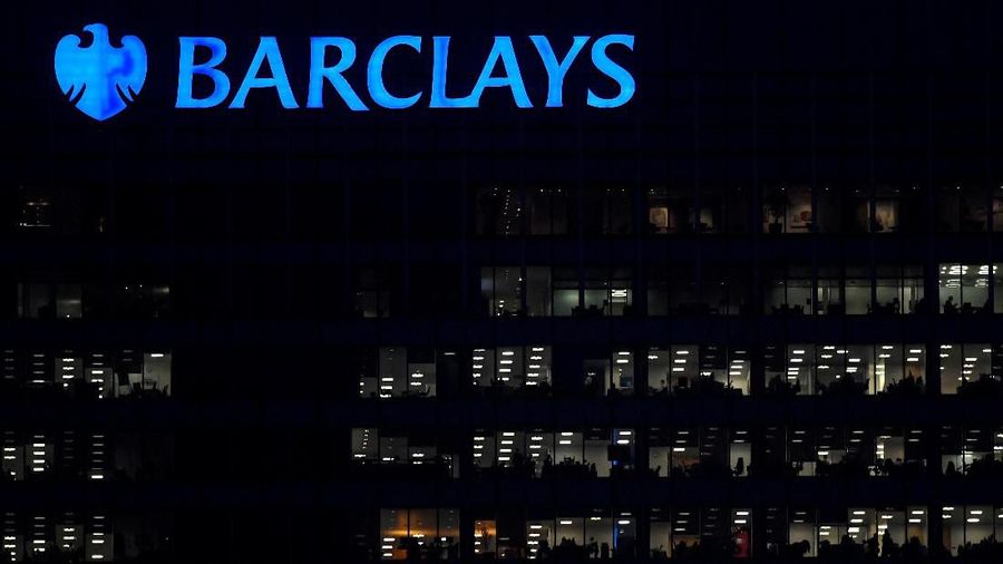 FILE PHOTO: Workers are seen in at Barclays bank offices in the Canary Wharf financial district in London, Britain, November 17, 2017. Picture taken November 17, 2017. REUTERS/Toby Melville/File Photo