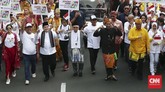 Pasangan Capres-Cawapres Jokowi dan Ma'ruf Amin mengikuti Pawai Deklarasi Pemilu Damai 2019-2024 di kawasan Monas dan Patung Kuda, Jakarta, Minggu (23/9/2018). (CNN Indonesia/Andry Novelino).