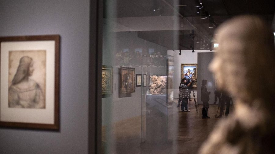 Tourists wait to see Leonardo da Vinci's painting Mona Lisa, at the Louvre museum, in Paris, Wednesday, Oct. 23, 2019. The Louvre, the home of the 