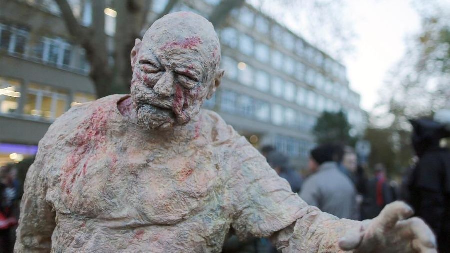 A person dressed up as a zombie attends a zombie walk on Halloween in Essen, Germany, October 31, 2019. REUTERS/Leon Kuegeler