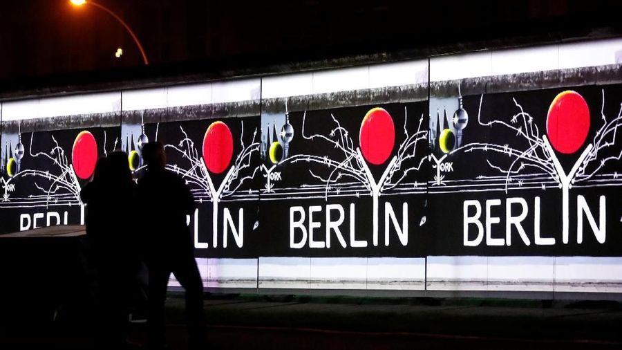 Video footage linked to the Fall of the Berlin Wall is projected during a rehearsal with 3D video beamers on the East Side Gallery, the largest remaining part of the former Berlin Wall, in Berlin, Germany, November 3, 2019. On November 9th Germany will mark the 30th anniversary of the fall of the Berlin Wall (Berliner Mauer) in 1989.    REUTERS/Fabrizio Bensch