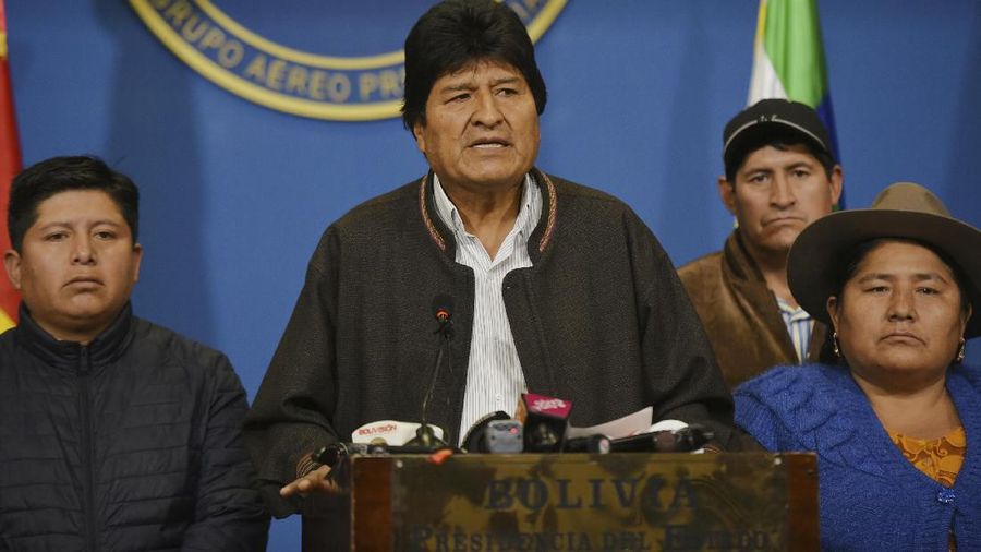 In this photo provided by the Agencia Boliviana de Informacion, Bolivian President Evo Morales speaks from the presidential hangar in El Alto, Bolivia, Sunday, Nov. 10, 2019. Bolivia's military chief Gen. Williams Kaliman said that President Evo Morales should resign so that stability can be restored after weeks of protests over his disputed election. He stepped in after Morales agreed earlier in the day to hold a new election. (Enzo De Luca/Agencia Boliviana de Informacion via AP)