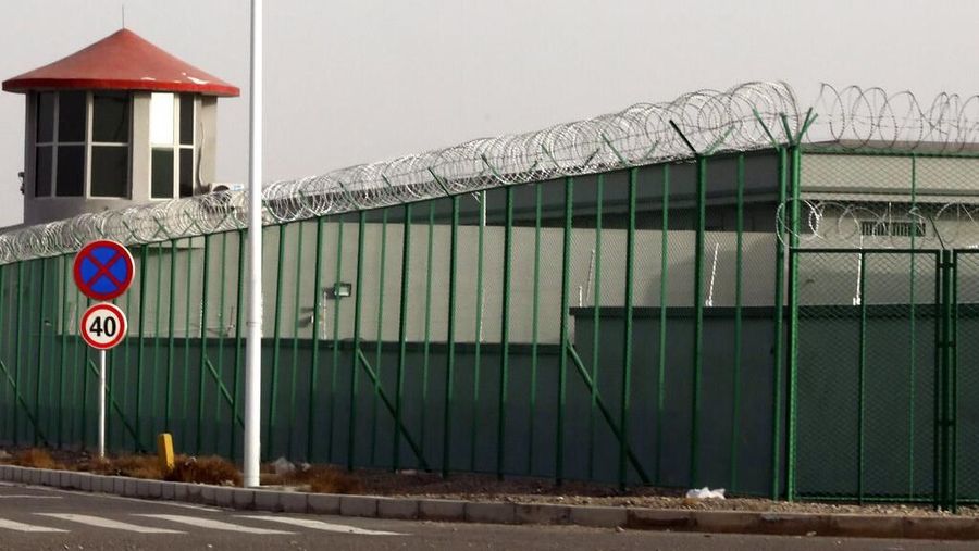FILE.- In this Monday, Dec. 3, 2018, file photo, a guard tower and barbed wire fences are seen around a section of the Artux City Vocational Skills Education Training Service Center in Artux in western China's Xinjiang region. This is one of a growing number of internment camps in the Xinjiang region, where by some estimates over 1 million Muslims have been detained, forced to give up their language and their religion and subject to political indoctrination. Confidential documents, leaked to a consortium of news organizations, lay out the Chinese government's deliberate strategy to lock up ethnic minorities to rewire their thoughts and even the language they speak. One of the documents says that internment camps â€“ such as the one in Artux â€“ are to install guard towers, as well as other security measures to 