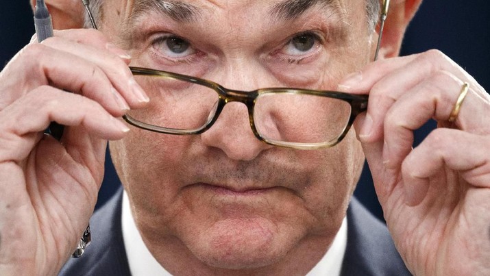 Federal Reserve Chair Jerome Powell removes his glasses as he listens to a question during a news conference after the Federal Open Market Committee meeting, Wednesday, Dec. 11, 2019, in Washington. The Federal Reserve is leaving its benchmark interest rate alone and signaling that it expects to keep low rates unchanged through next year. (AP Photo/Jacquelyn Martin)