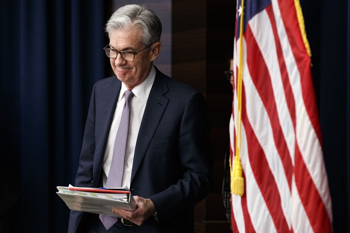 Federal Reserve Chair Jerome Powell arrives to speak at a news conference after the Federal Open Market Committee meeting, Wednesday, Dec. 11, 2019, in Washington. The Federal Reserve is leaving its benchmark interest rate alone and signaling that it expects to keep low rates unchanged through next year. (AP Photo/Jacquelyn Martin)