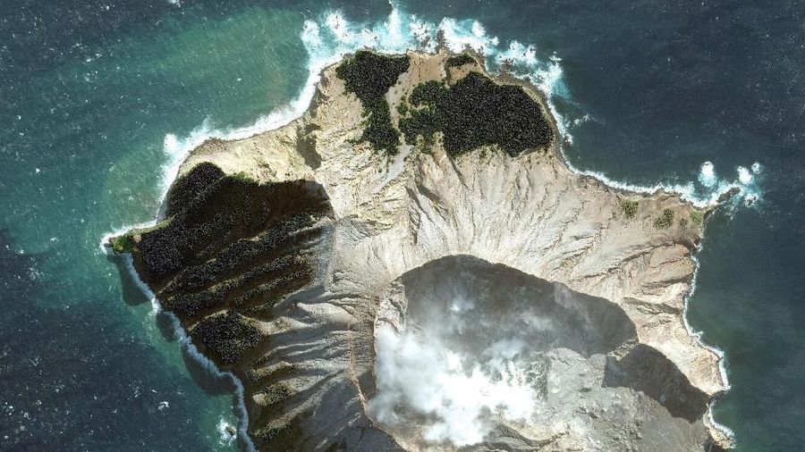 This May 12, 2019 satellite image provided by Maxar Technologies shows White Island in New Zealand before a volcano erupted on Monday, Dec. 9. (Satellite image Â©2019 Maxar Technologies via AP)