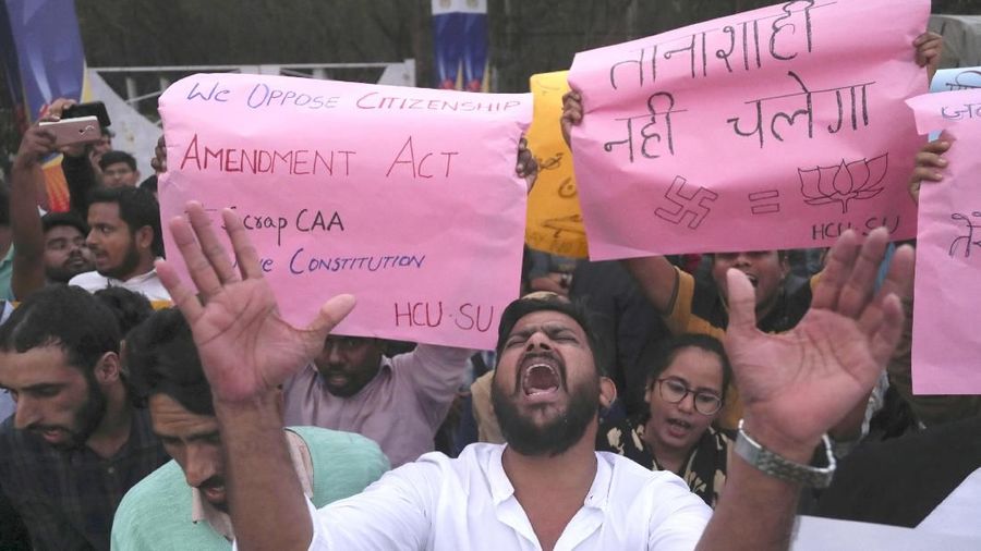 Indian Hyderabad Central University (HCU) students shout slogans during a protest rally against a new citizenship law in Hyderabad, India, Monday, Dec.16, 2019. The new law gives citizenship to non-Muslims who entered India illegally to flee religious persecution in several neighboring countries. (AP Photo/Mahesh Kumar A.)