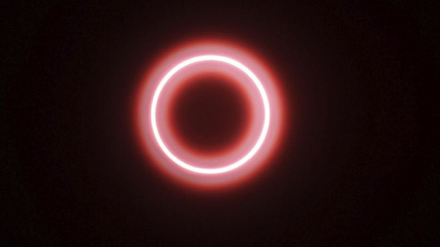 An annular solar eclipse is seen though safety glass from Siak, Riau province, Indonesia, Thursday, Thursday, Dec. 26, 2019. People along a swath of southern Asia gazed at the sky in marvel on Thursday at a 