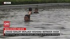 VIDEO: Lokasi Banjir Menjadi Wahana Bermain Anak