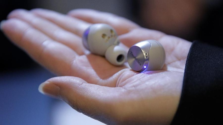 A person holds the Technics EAH-AZ70W earbuds during a Panasonic news conference before the CES tech show, Monday, Jan. 6, 2020, in Las Vegas. (AP Photo/John Locher)