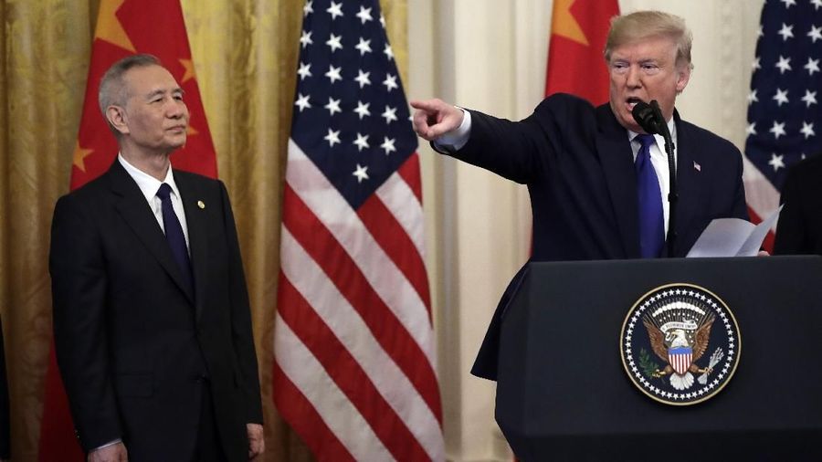 President Donald Trump speaks before signing a trade agreement with Chinese Vice Premier Liu He, left, in the East Room of the White House, Wednesday, Jan. 15, 2020, in Washington. (AP Photo/Evan Vucci)