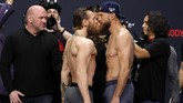 Duel McGregor lawan Cerrone jadi pembuka 2020 yang sangat seru bagi laga-laga UFC di tahun ini. (Steve Marcus/Getty Images/AFP)