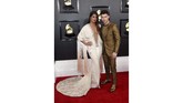 Aktris Priyanka Chopra tampil mendampingi sang suami Nick Jonas dalam balutan gaun Ralph & Russo. Namun, model gaun yang jatuh dan detail fringe panjang membuatnya tampak berat. (Photo by Jordan Strauss/Invision/AP)