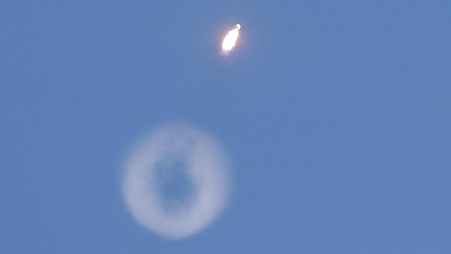 A Falcon 9 SpaceX rocket with a payload of approximately 60 satellites for SpaceX's Starlink broadband network creates a vapor ring high in the sky as it lifts off from Space Launch Complex 40 at the Cape Canaveral Air Force Station in Cape Canaveral, Fla., Wednesday, Jan. 29, 2020. (AP Photo/John Raoux)