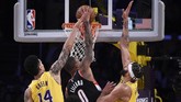 Damian Lillard jadi kunci kemenangan Blazers atas Lakers. Catatan 48 poin Lillard membuat Blazers menang 127-119. (AP Photo/Kelvin Kuo)
