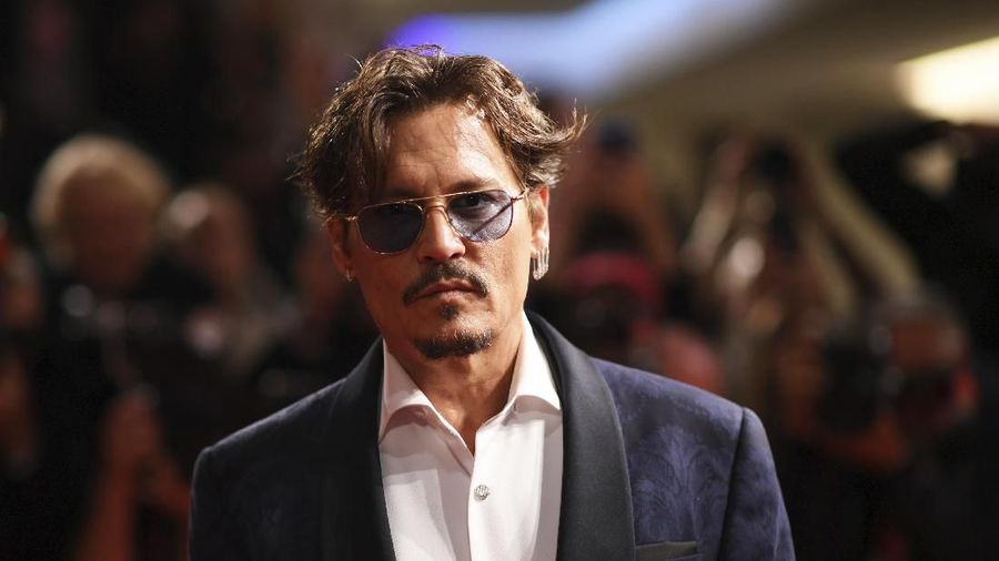Actor Johnny Depp poses for photographers upon arrival at the premiere of the film 'Waiting for the Barbarians' at the 76th edition of the Venice Film Festival, Venice, Italy, Friday, Sept. 6, 2019. (Photo by Arthur Mola/Invision/AP)