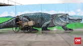 Mural juga dianggap sebagai ekspresi kritik, pernyataan sikap, hingga estetika dan simbol kota. (CNNIndonesia/Safir Makki)