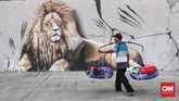 Fungsi mural kini tak hanya menjadi ruang interaktif antara seniman, warga, dan lingkungan. (CNNIndonesia/Safir Makki)