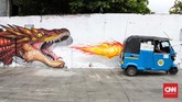 Hari ini, seni mural seolah sudah menjadi identitas baru sebuah kota, seperti gambar-gambar yang menghiasi kawasan Kali Opak, Jakarta Utara. (CNNIndonesia/Safir Makki)