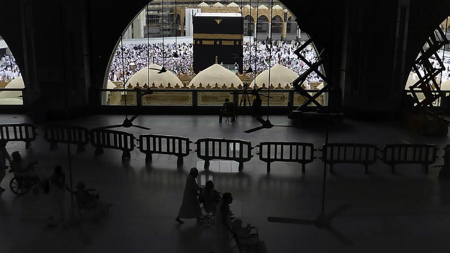 In this Monday, Feb. 24, 2020, photo, Muslim pilgrims circumambulate around the Kaaba, the cubic building at the Grand Mosque, during the minor pilgrimage, known as Umrah in the Muslim holy city of Mecca, Saudi Arabia. Saudi Arabia on Thursday, Feb. 27, 2020, halted forei to the holiest sites in Islam over fears about a new viral epidemic just months ahead of the annual hajj pilgrimage. (AP Photo/Amr Nabil)