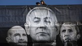 Partai Likud, kelompok koalisi faksi sayap kanan mengklaim unggul dalam hitung cepat sementara dalam Pemilu Israel, Senin (2/3). (AP Photo/Oded Balilty)