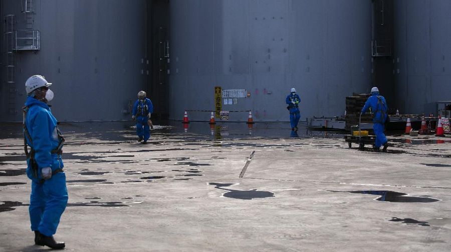 In this Feb. 12, 2020, photo, the Unit 1 and 2 reactor buildings, damaged by the 2011 earthquake and tsunami, are seen at the Fukushima Dai-ichi nuclear power plant in Okuma, Fukushima Prefecture, Japan. Nine years ago, on March 11, 2011, a magnitude 9.0 quake and tsunami destroyed key cooling functions at the plant, causing a meltdown that leaked a massive amount of radiation and forcing some 160,000 residents to evacuate. About 40,000 of them still haven't returned. (AP Photo/Jae C. Hong)
