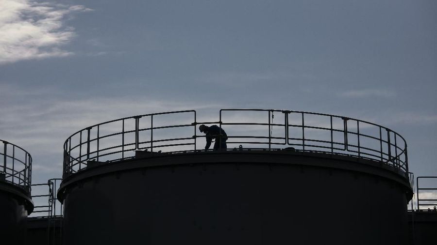 In this Feb. 12, 2020, photo, the Unit 1 and 2 reactor buildings, damaged by the 2011 earthquake and tsunami, are seen at the Fukushima Dai-ichi nuclear power plant in Okuma, Fukushima Prefecture, Japan. Nine years ago, on March 11, 2011, a magnitude 9.0 quake and tsunami destroyed key cooling functions at the plant, causing a meltdown that leaked a massive amount of radiation and forcing some 160,000 residents to evacuate. About 40,000 of them still haven't returned. (AP Photo/Jae C. Hong)