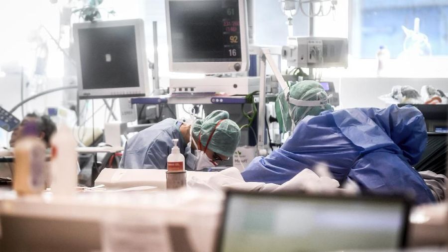 Medical personnel at work in the intensive care unit of the hospital of Brescia, Italy, Thursday, March 19, 2020. Italy has become the country with the most coronavirus-related deaths, surpassing China by registering 3,405 dead. Italy reached the gruesome milestone on the same day the epicenter of the pandemic, Wuhan, China, recorded no new infections. For most people, the new coronavirus causes only mild or moderate symptoms. For some it can cause more severe illness. (Claudio Furlan/LaPresse via AP)