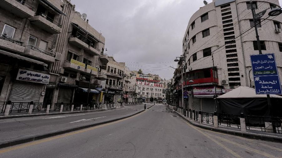 The streets of the Jordanian Capital are seen empty after the start of a nationwide curfew, amid concerns over the coronavirus pandemic, in Amman, Jordan,Saturday, March 21, 2020.  Air raid sirens have echoed across Jordan's capital to mark the start of a three-day curfew. It's the latest mass lockdown in the Middle East aimed at containing the coronavirus (AP Photo/Raad Adayleh)