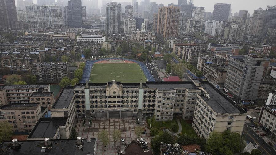 A view of the city of Wuhan taken from a quarantine hotel in central China's Hubei province on Monday, March 30, 2020. Shopkeepers in the city at the center of China's virus outbreak were reopening Monday but customers were scarce after authorities lifted more of the anti-virus controls that kept tens of millions of people at home for two months. (AP Photo/Ng Han Guan)