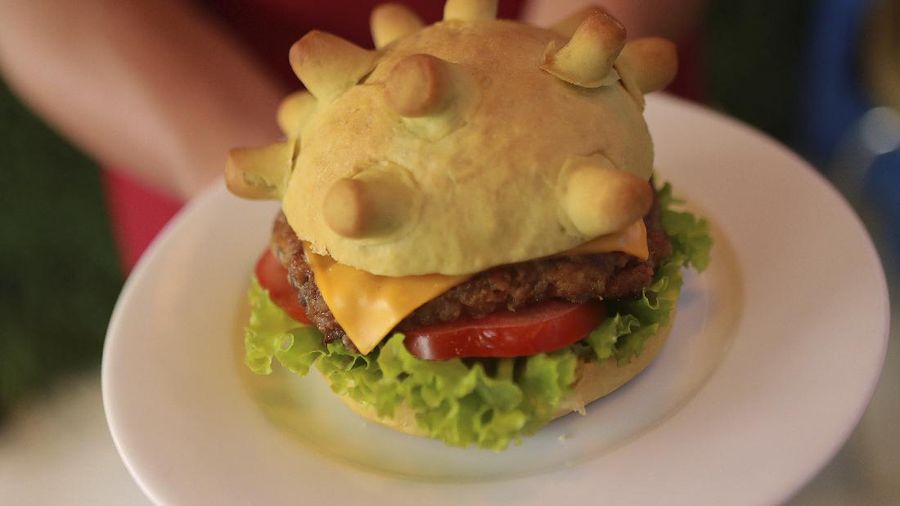 Restaurant owner Hoang Tung holds up a