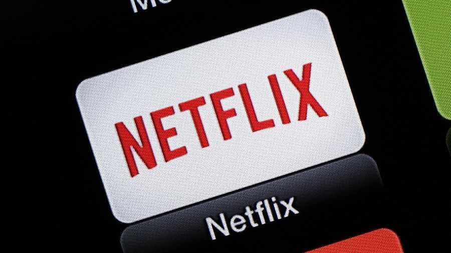 FILE - This June 24, 2015, file photo, shows the Netflix Apple TV app icon, in South Orange, N.J. Netflix reports financial results on Monday, April 18, 2016. Sports are on hold, movie theaters are closed and so are amusement parks. But Americans held captive at home by the coronavirus can turn to Netflix, Amazon, Hulu and other streaming services, outliers in an entertainment industry otherwise brought to an unprecedented standstill. (AP Photo/Dan Goodman, File)