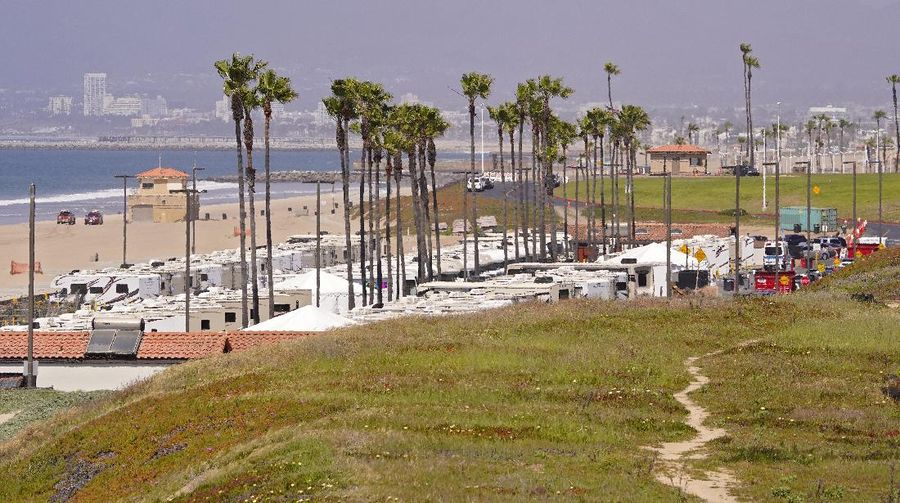 An RV park at Dockweiler State Beach, where some coronavirus patients are being quarantined, is viewed Friday, April 3, 2020, in Los Angeles. The new coronavirus causes mild or moderate symptoms for most people, but for some, especially older adults and people with existing health problems, it can cause more severe illness or death. (AP Photo/Mark J. Terrill)